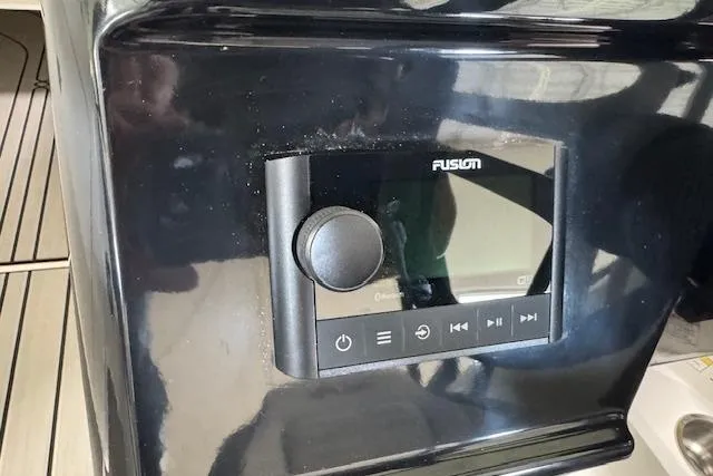 Slide: The Image of Fusion audio control panel on 2025 Sea Ray SPX 210 boat dashboard. - 15
