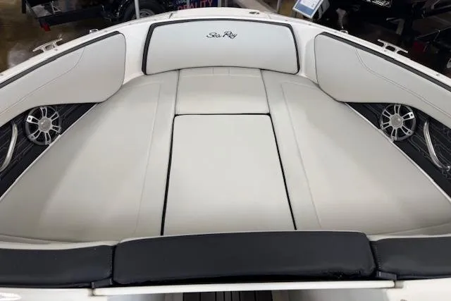 Slide: The Image of 2025 Sea Ray SPX 210 boat interior with white cushioned seating and sleek design. - 8