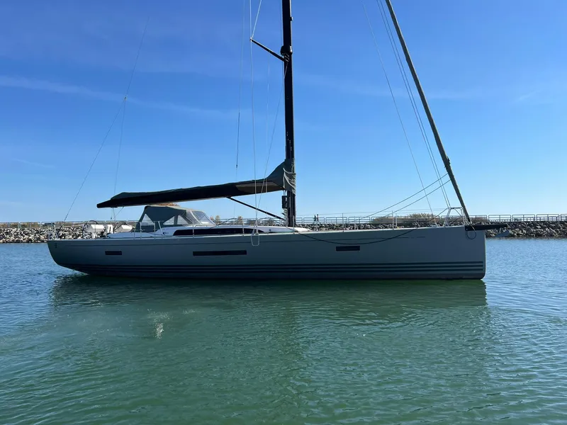 The Image of 2015 X-Yachts Xp 55 sailboat on calm water under clear blue sky. - 0
