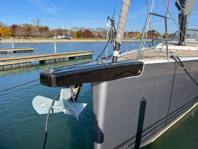 Slide: The Image of 2015 X-Yachts Xp 55 sailboat docked, featuring sleek bow design and anchor. - 10