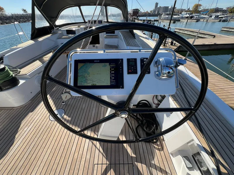 Slide: The Image of Steering wheel and navigation system on 2015 X-Yachts Xp 55 sailboat deck. - 14