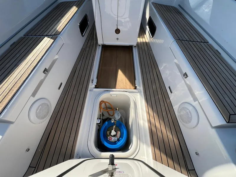 Slide: The Image of 2015 X-Yachts Xp 55 yacht deck with storage compartment and wooden flooring. - 22