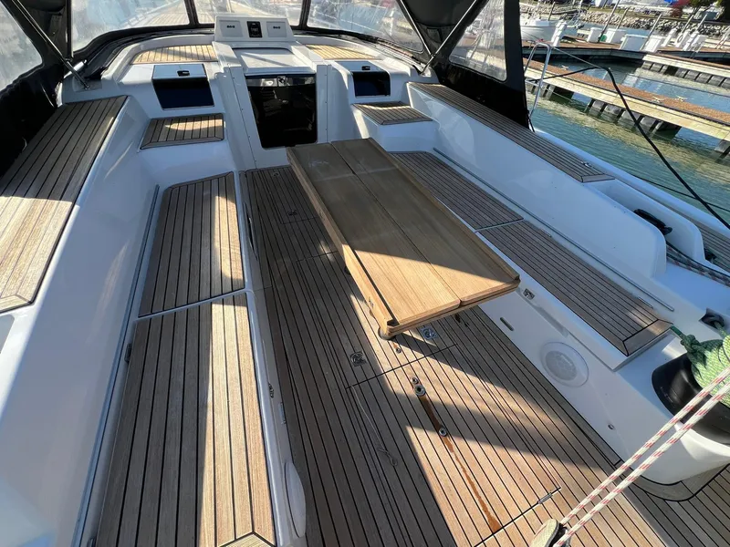 Slide: The Image of Spacious cockpit of 2015 X-Yachts Xp 55 with wooden seating and table. - 24