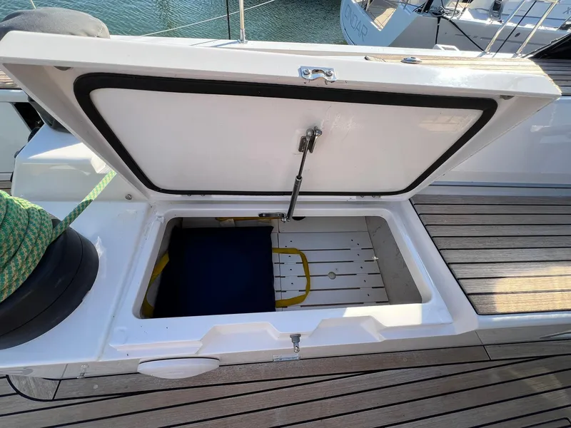 Slide: The Image of Open storage compartment on 2015 X-Yachts Xp 55 sailboat deck. - 25