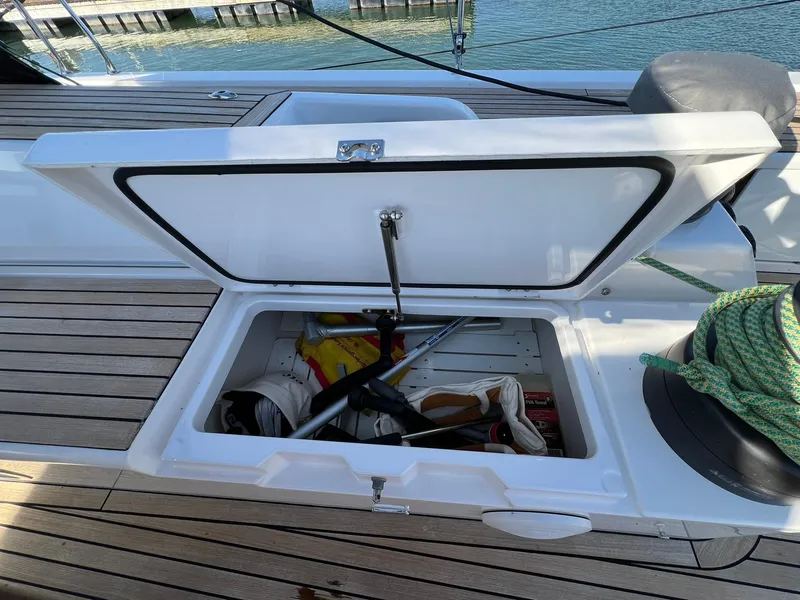 Slide: The Image of Open storage compartment on 2015 X-Yachts Xp 55 sailboat deck. - 26