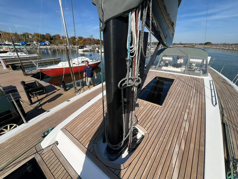 Slide: The Image of Xp 55 sailboat deck with mast, docked at marina, clear sky, 2015 X-Yachts model. - 31