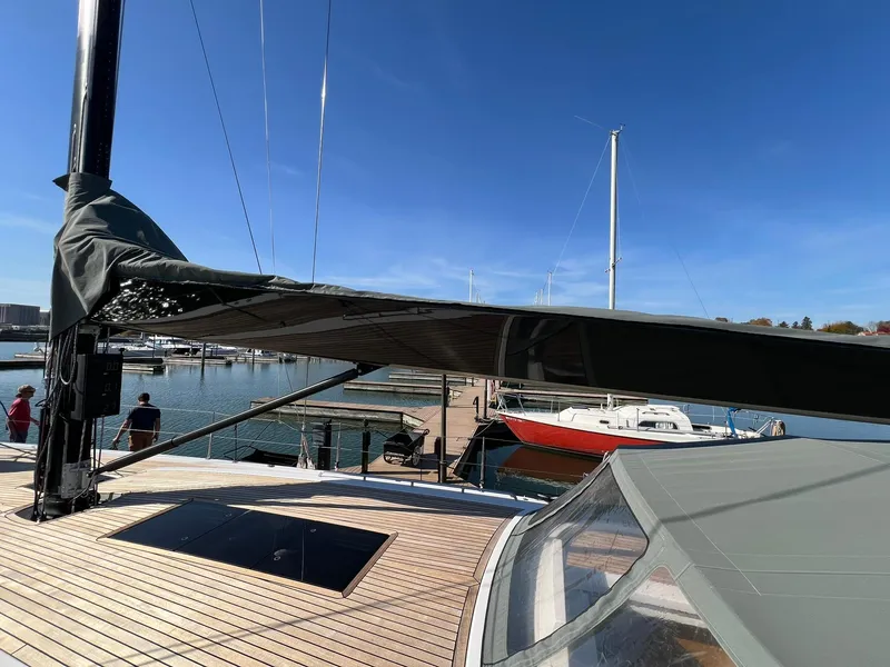 Slide: The Image of 2015 X-Yachts Xp 55 sailboat docked at marina under clear blue sky. - 32