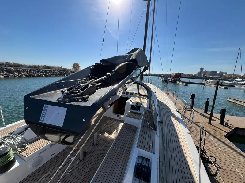 Slide: The Image of 2015 X-Yachts Xp 55 sailboat docked at marina under clear blue sky. - 33