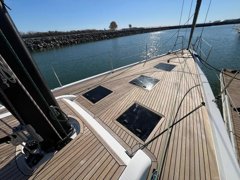 Slide: The Image of 2015 X-Yachts Xp 55 sailboat deck with sleek design and open water view. - 34