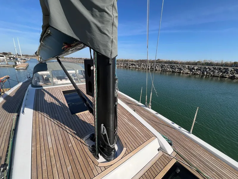 Slide: The Image of 2015 X-Yachts Xp 55 sailboat with teak deck, docked in a marina. - 38