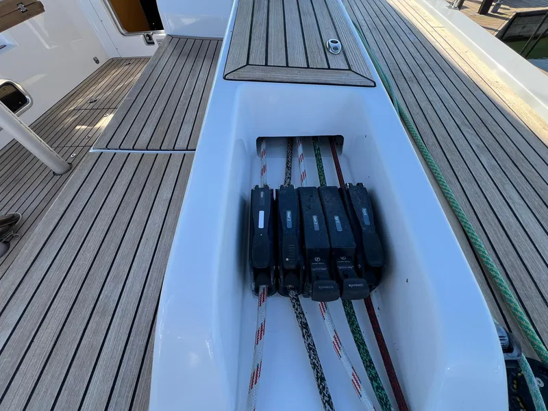 Slide: The Image of Deck of 2015 X-Yachts Xp 55 sailboat with rope clutches and teak flooring. - 40