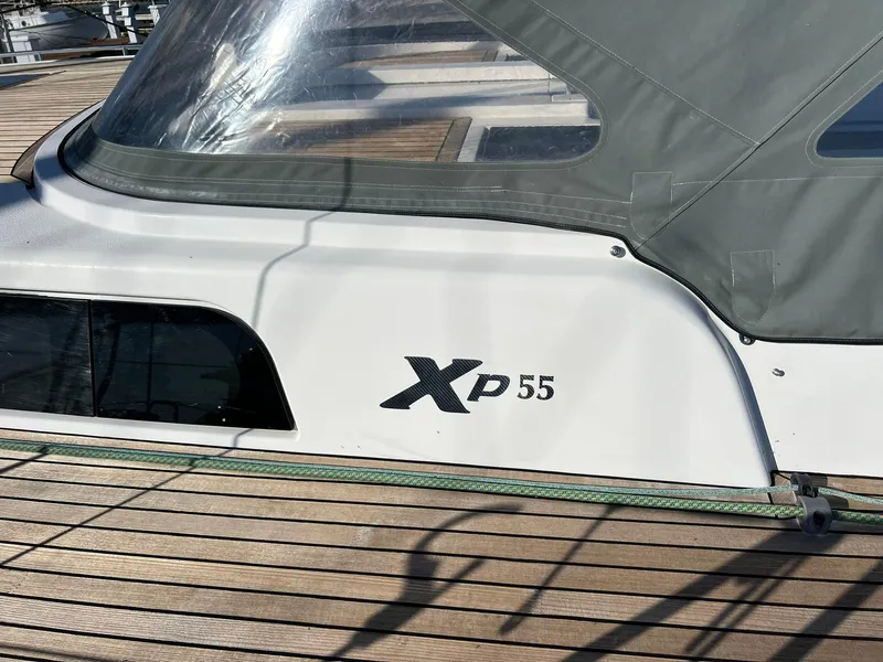 Slide: The Image of 2015 X-Yachts Xp 55 sailboat with sleek design and wooden deck. - 42