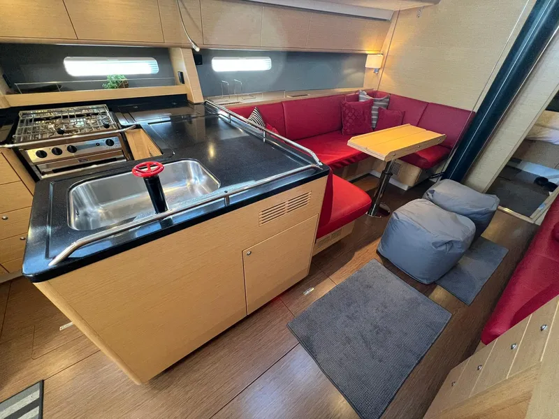 Slide: The Image of Luxurious interior of 2015 X-Yachts Xp 55 with modern kitchen and cozy seating area. - 45