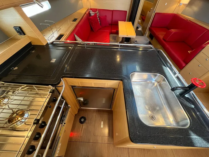 Slide: The Image of Luxurious 2015 X-Yachts Xp 55 yacht interior with modern kitchen and red seating area. - 46
