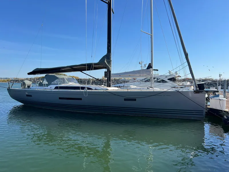 Slide: The Image of 2015 X-Yachts Xp 55 sailboat docked in a marina under clear blue skies. - 5