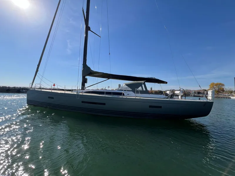 Slide: The Image of 2015 X-Yachts Xp 55 sailboat on calm water under clear blue sky. - 6