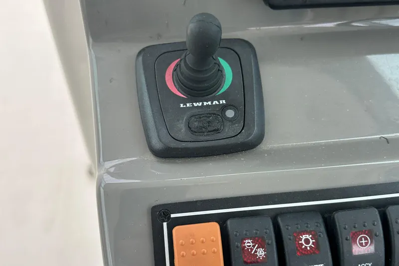 Slide: The Image of Control panel of a 2019 Pursuit DC 325 boat with Lewmar joystick. - 10