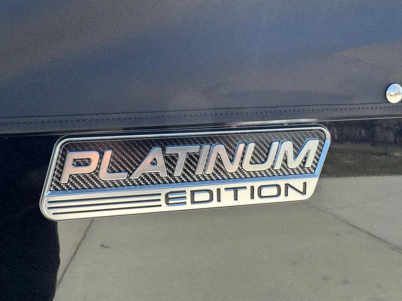 Slide: The Image of 2025 Tahoe Pontoon LTZ Quad Lounger Shift, Platinum Edition badge on sleek surface. - 4