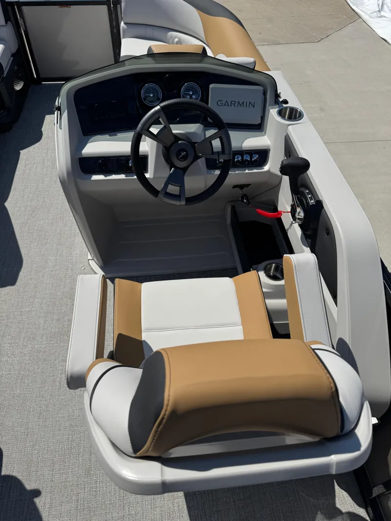 Slide: The Image of 2025 Tahoe Pontoon LTZ Quad Lounger Shift helm with Garmin navigation system. - 9