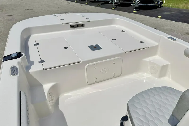Slide: The Image of 2025 Carolina Skiff 21 LS boat interior with storage compartments and seating. - 10