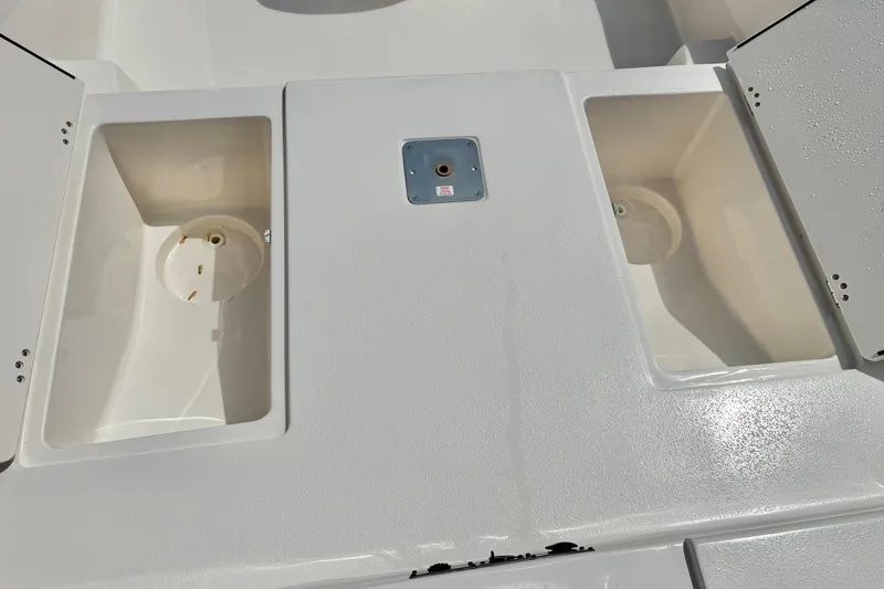 Slide: The Image of 2025 Carolina Skiff 21 LS boat deck with storage compartments. - 13