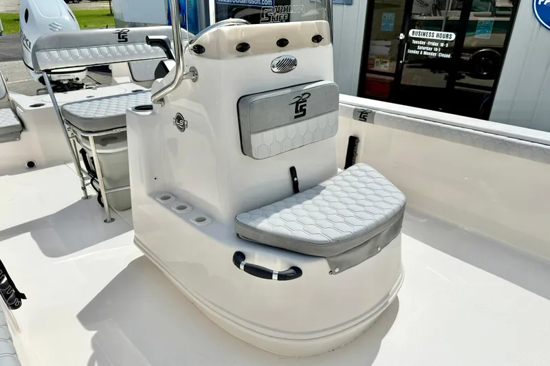 Slide: The Image of 2025 Carolina Skiff 21 LS boat interior with seating and console design. - 15
