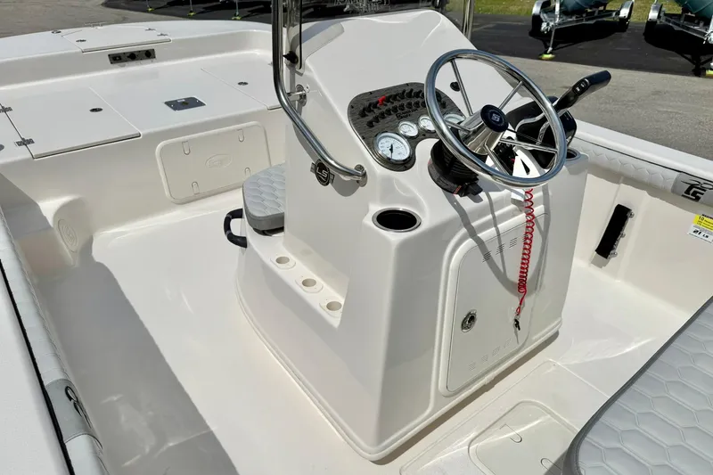 Slide: The Image of 2025 Carolina Skiff 21 LS boat console with steering wheel and gauges. - 18