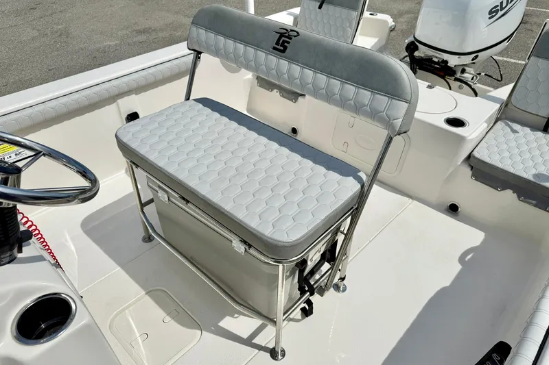 Slide: The Image of 2025 Carolina Skiff 21 LS boat interior with cushioned seating and storage. - 21