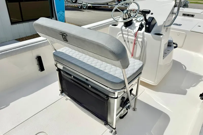 Slide: The Image of 2025 Carolina Skiff 21 LS boat interior with steering console and seating. - 23