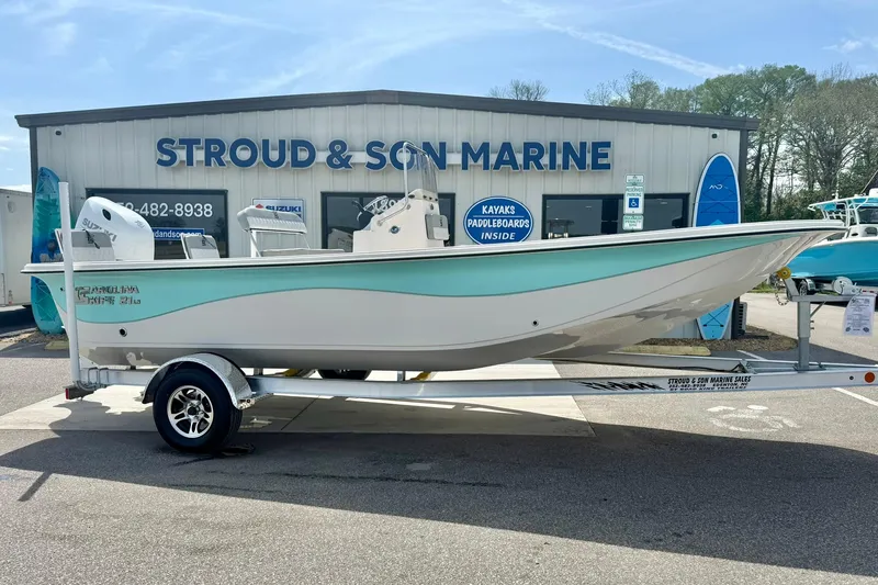 Slide: The Image of 2025 Carolina Skiff 21 LS boat on trailer at Stroud & Son Marine dealership. - 4