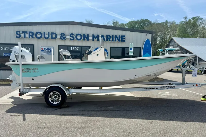 Slide: The Image of 2025 Carolina Skiff 21 LS boat on trailer at Stroud & Son Marine dealership. - 6