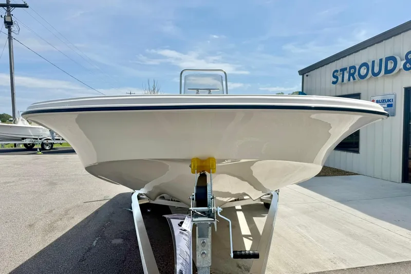 Slide: The Image of 2025 Carolina Skiff 21 LS boat on trailer, parked outside dealership. - 8