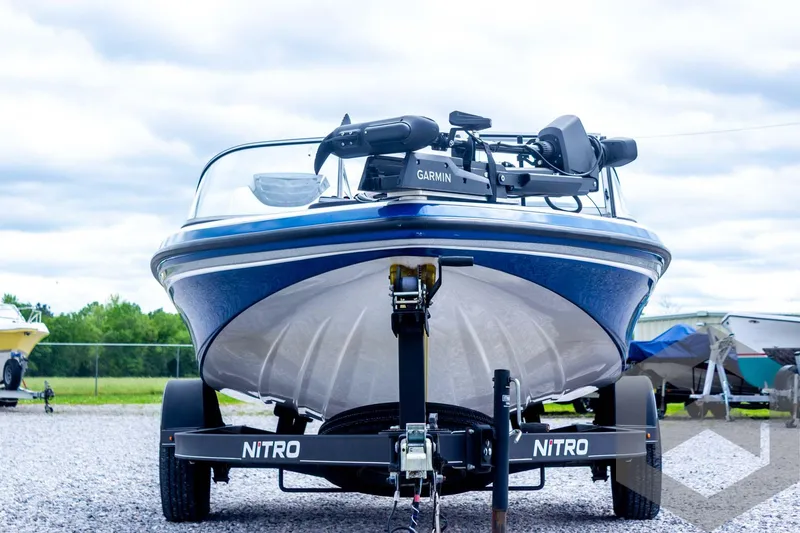 Slide: The Image of 2022 Nitro Z19 Sport boat on trailer, featuring Garmin equipment, parked outdoors. - 10