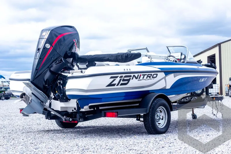 Slide: The Image of 2022 Nitro Z19 Sport boat on trailer, featuring sleek design and powerful outboard motor. - 13