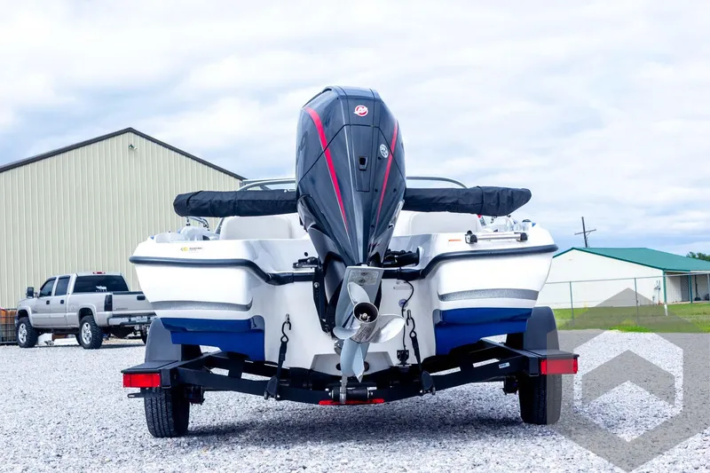 Slide: The Image of 2022 Nitro Z19 Sport boat on trailer, rear view, parked outdoors. - 14