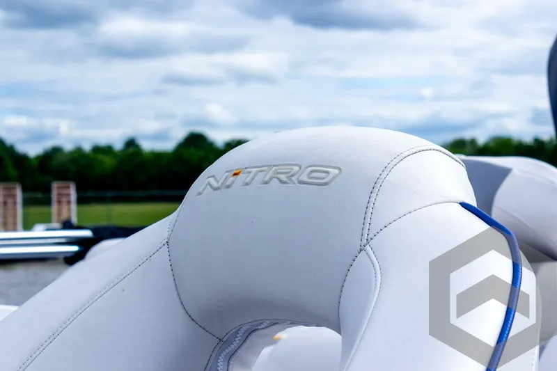 Slide: The Image of 2022 Nitro Z19 Sport boat seat with logo, against a cloudy sky backdrop. - 22