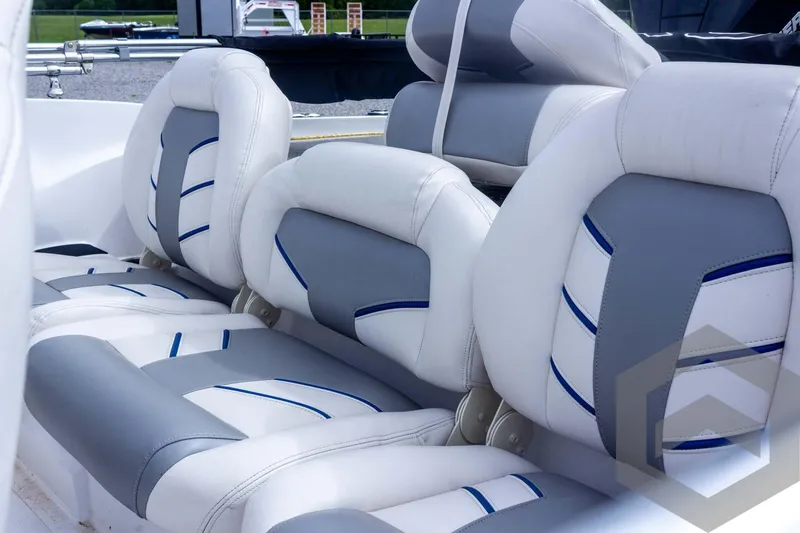 Slide: The Image of 2022 Nitro Z19 Sport boat seats, featuring white and gray upholstery with blue accents. - 23