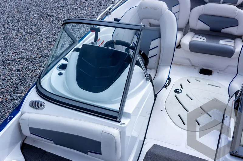 Slide: The Image of 2022 Nitro Z19 Sport boat interior with sleek seating and modern dashboard design. - 30
