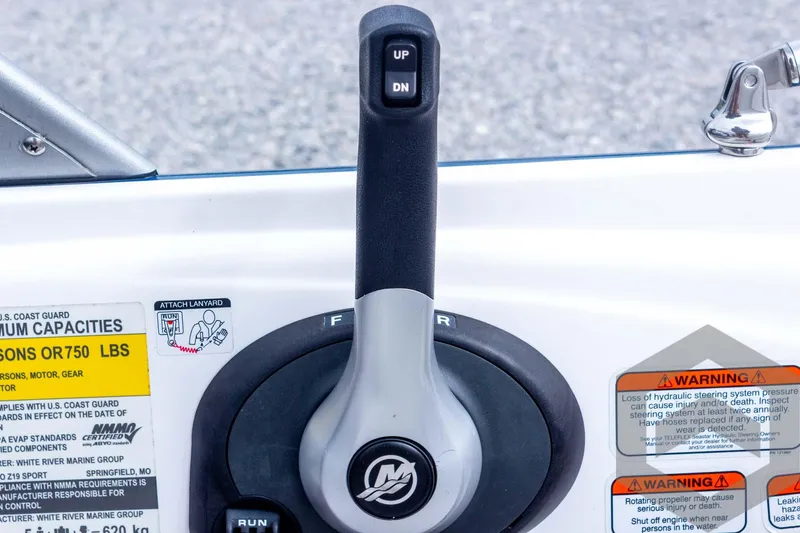 Slide: The Image of Throttle control of 2022 Nitro Z19 Sport boat with warning labels. - 38