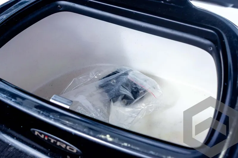 Slide: The Image of Open storage compartment of 2022 Nitro Z19 Sport boat with plastic-wrapped item inside. - 41