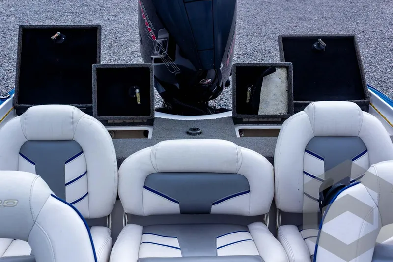 Slide: The Image of 2022 Nitro Z19 Sport boat interior with open storage compartments and cushioned seating. - 42