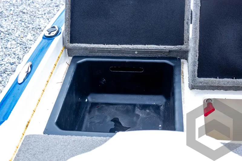 Slide: The Image of Open storage compartment in a 2022 Nitro Z19 Sport boat. - 46