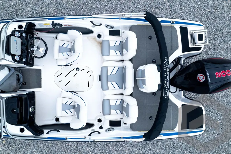 Slide: The Image of 2022 Nitro Z19 Sport boat interior with seating and controls, aerial view. - 49