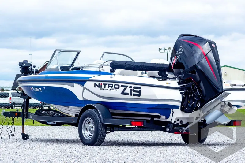 Slide: The Image of 2022 Nitro Z19 Sport boat with powerful outboard motor on a trailer. - 7