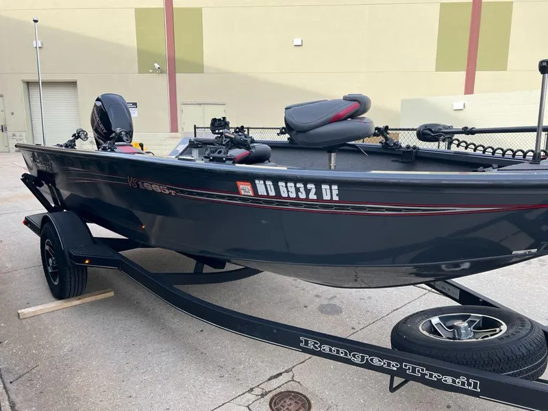 Slide: The Image of 2022 Ranger VS1665T fishing boat on trailer, parked outdoors. - 6