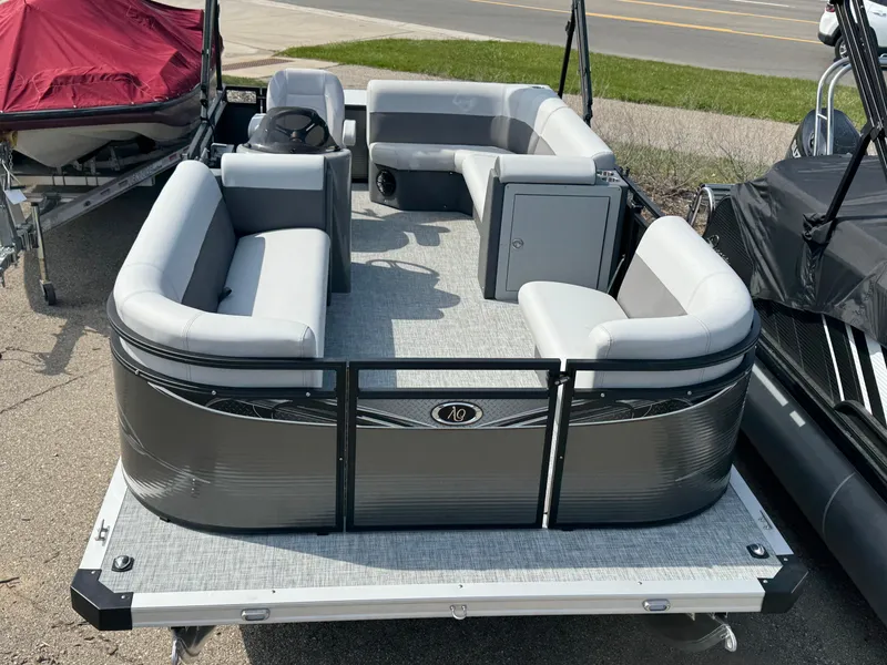 Slide: The Image of 2025 Qwest E 20 Lanai pontoon boat with gray seating and modern design. - 9