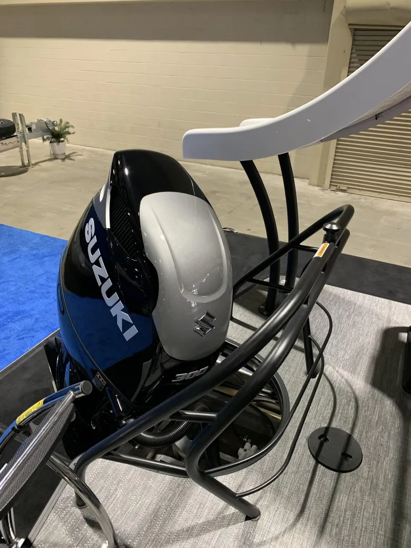Slide: The Image of Suzuki outboard motor on 2025 Godfrey Monaco 235 SD boat display. - 3