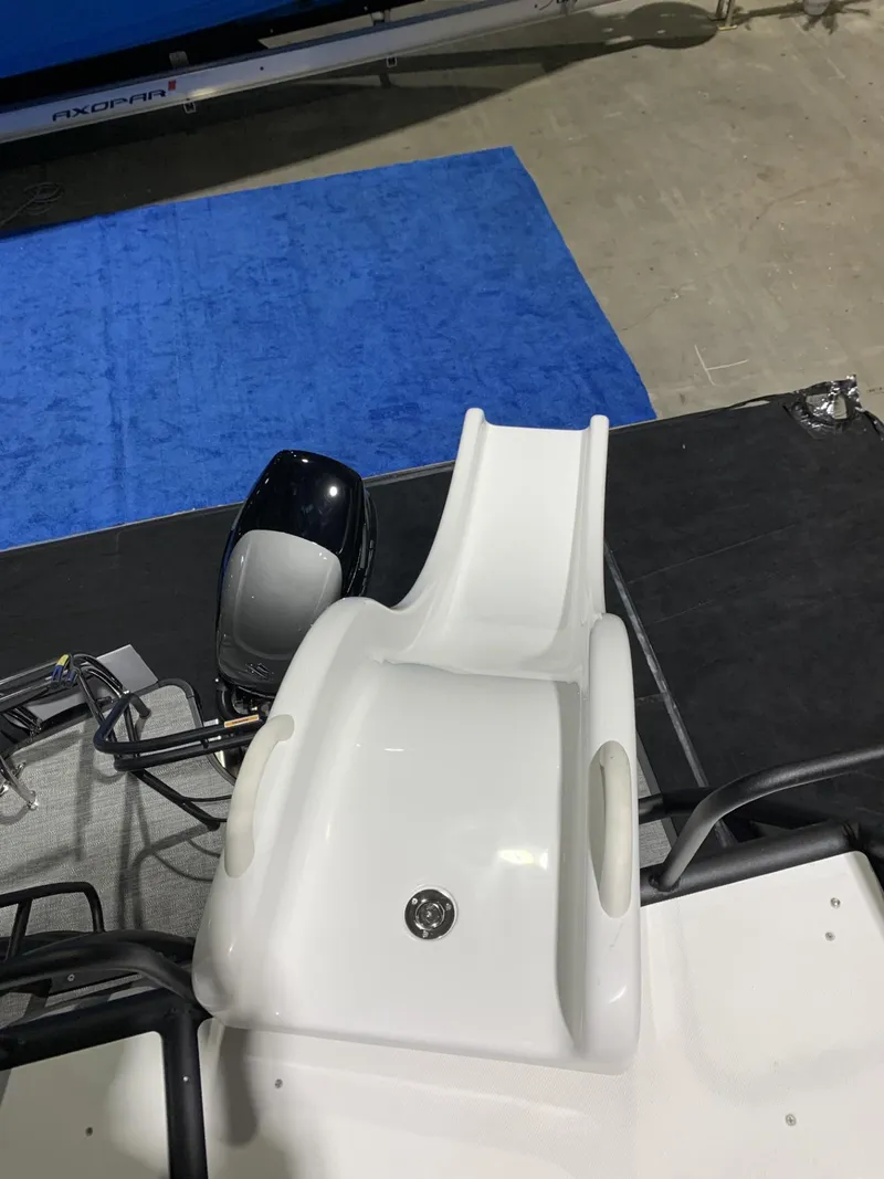 Slide: The Image of 2025 Godfrey Monaco 235 SD boat with a white slide and motor. - 7