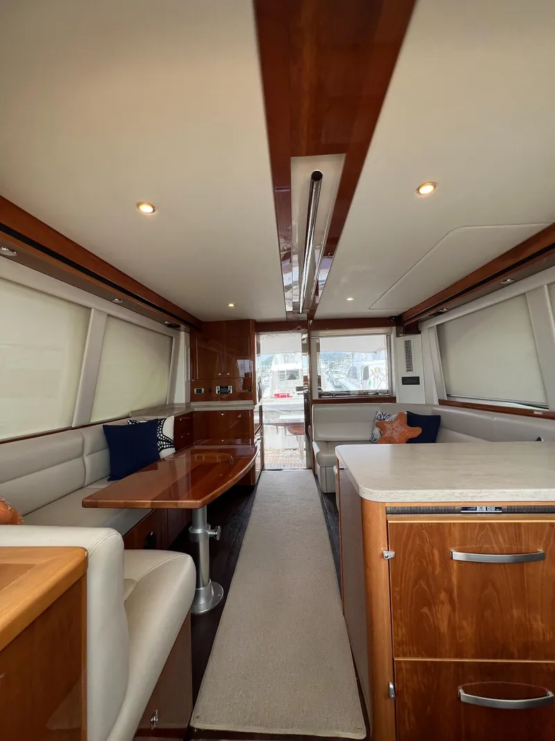 Slide: The Image of Luxurious interior of 2016 Riviera 45 Open Flybridge yacht with elegant wood finishes. - 4