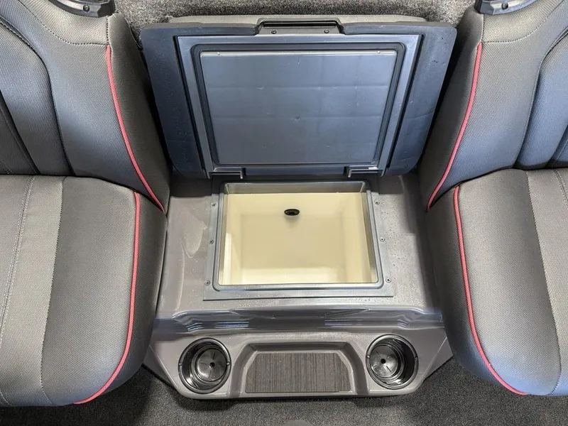 Slide: The Image of Interior of 2025 Skeeter ZXR20 boat with open storage compartment and cup holders. - 11